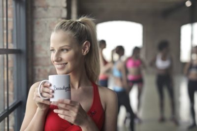 woman-wearing-red-tank-top-holding-white-ceramic-mug-863935 (Klein)